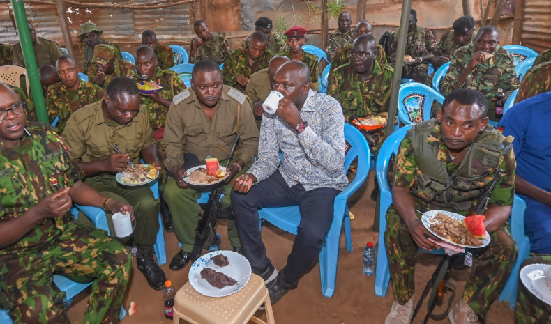 Interior CS Murkomen shares a meal with security officers.